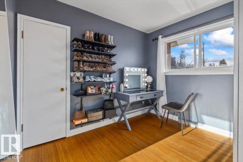 Hardwood flooring, a white trim window, and a built-in shelving system - 10756 133 Street, Edmonton, AB - Indoor