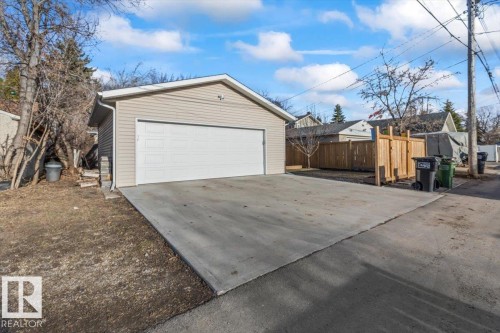 Detached garage featuring horizontal siding and an overhead door - 10756 133 Street, Edmonton, AB - Outdoor