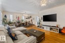 Hardwood flooring throughout the living and dining areas - 10756 133 Street, Edmonton, AB  - Indoor Photo Showing Living Room 