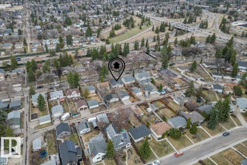 Aerial view showcasing a residential neighborhood with established homes and mature trees - 10756 133 Street, Edmonton, AB -  With View