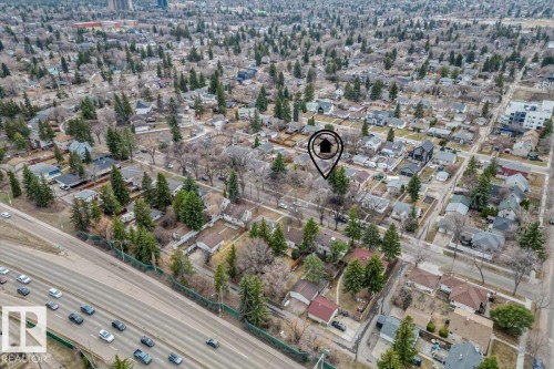 Aerial perspective showcasing a residential neighborhood with a prominent multi-lane roadway bordering the area - 10756 133 Street, Edmonton, AB - Outdoor With View