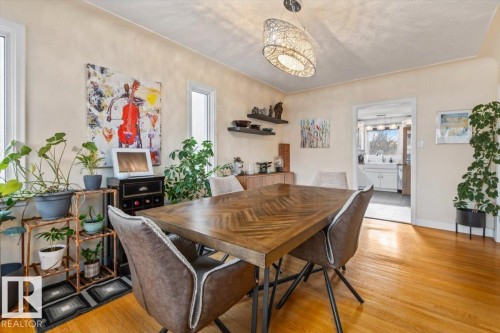 Dining area featuring warm wood-finish flooring - 10756 133 Street, Edmonton, AB - Indoor Photo Showing Dining Room