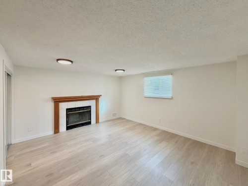 14309 128A Street, Edmonton, AB - Indoor Photo Showing Living Room With Fireplace