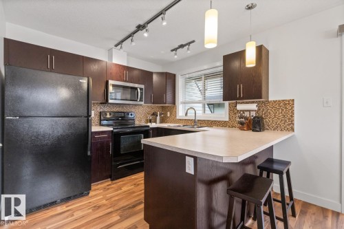 13 4950 Terwillegar Common, Edmonton, AB - Indoor Photo Showing Kitchen With Double Sink