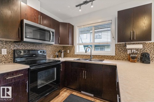 13 4950 Terwillegar Common, Edmonton, AB - Indoor Photo Showing Kitchen With Double Sink