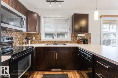 13 4950 Terwillegar Common, Edmonton, AB - Indoor Photo Showing Kitchen With Double Sink