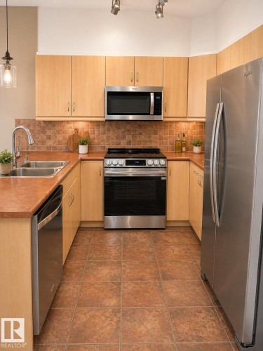 310 1406 Hodgson Way, Edmonton, AB - Indoor Photo Showing Kitchen With Stainless Steel Kitchen With Double Sink