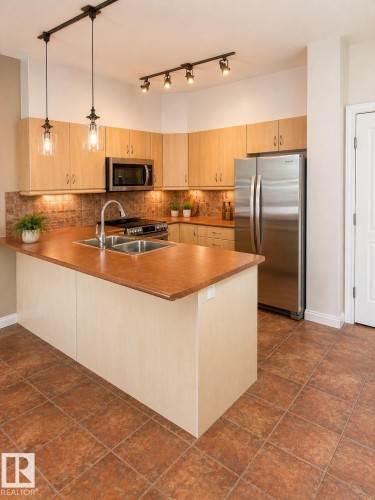 310 1406 Hodgson Way, Edmonton, AB - Indoor Photo Showing Kitchen With Stainless Steel Kitchen With Double Sink