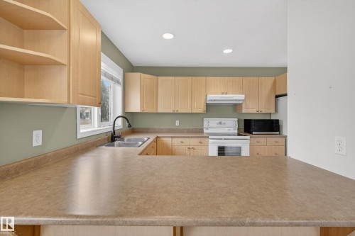 8721 88 Avenue, Edmonton, AB - Indoor Photo Showing Kitchen With Double Sink
