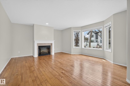 8721 88 Avenue, Edmonton, AB - Indoor Photo Showing Living Room With Fireplace
