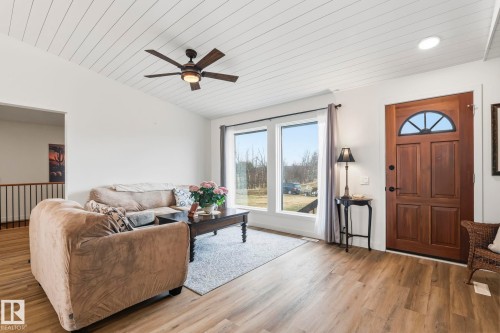Vaulted ceiling with shiplap detailing, wood-finish flooring, and recessed lighting - 23127 Twp Rd 502, Rural Leduc County, AB - Indoor