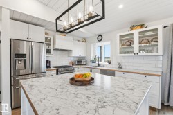 Kitchen island featuring a veined countertop - 