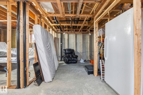 Unfinished basement offering exposed wood framing, concrete flooring, and visible plumbing and electrical infrastructure - 23127 Twp Rd 502, Rural Leduc County, AB - Indoor Photo Showing Basement