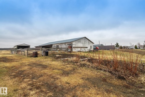 Multiple outbuildings featuring metal roofing and siding - 23127 Twp Rd 502, Rural Leduc County, AB - Outdoor
