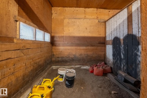 Interior space featuring wood plank walls and plywood ceiling - 23127 Twp Rd 502, Rural Leduc County, AB - Indoor Photo Showing Other Room