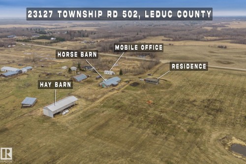 Expansive acreage featuring a residence, horse barn, hay barn, and mobile office - 23127 Twp Rd 502, Rural Leduc County, AB - Outdoor With View