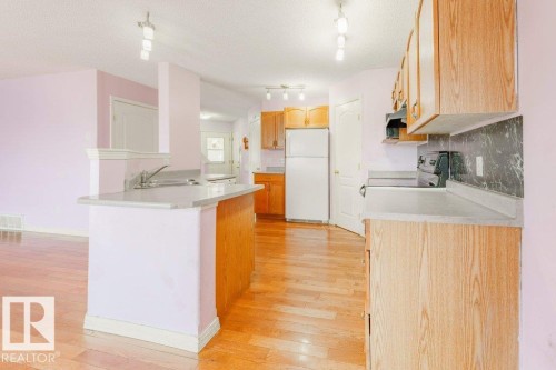 2144 37B Avenue, Edmonton, AB - Indoor Photo Showing Kitchen With Double Sink