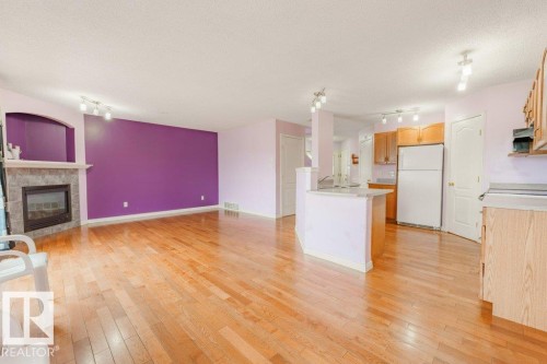 2144 37B Avenue, Edmonton, AB - Indoor Photo Showing Kitchen With Fireplace
