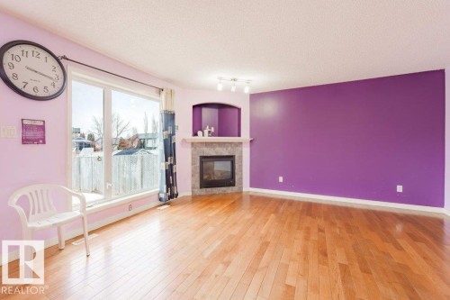2144 37B Avenue, Edmonton, AB - Indoor Photo Showing Living Room With Fireplace
