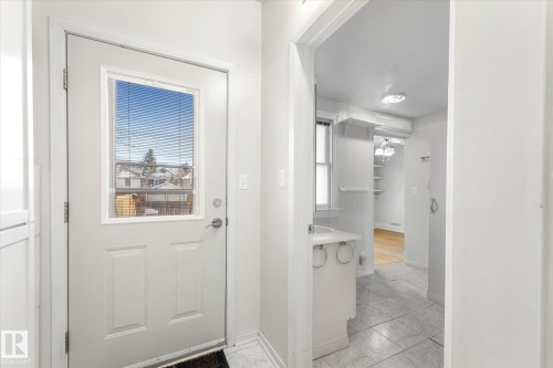 White paneled door with glass insert - 10921 126 Street, Edmonton, AB - Indoor Photo Showing Other Room