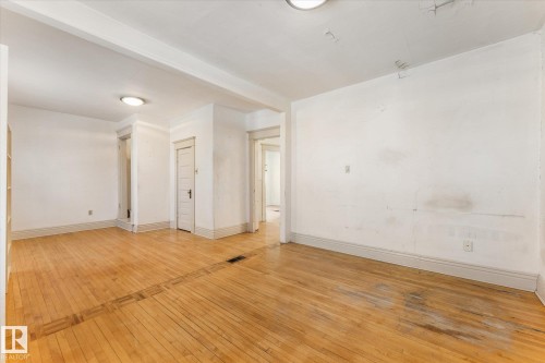 Hardwood flooring throughout, featuring a distinct border inlay - 10921 126 Street, Edmonton, AB - Indoor Photo Showing Other Room