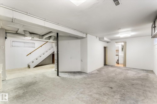 Spacious lower level offering concrete flooring and white painted walls - 10921 126 Street, Edmonton, AB - Indoor