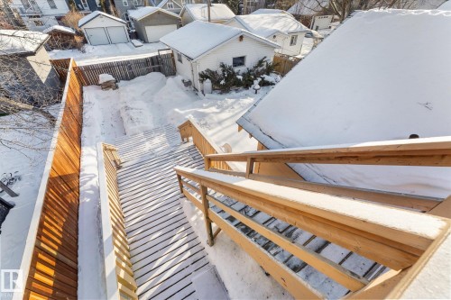 Multi-level exterior deck with natural wood railing and steps - 10921 126 Street, Edmonton, AB - Outdoor