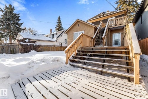 Expansive rear decking with multiple levels and natural wood railings - 10921 126 Street, Edmonton, AB - Outdoor
