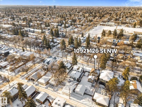 Aerial perspective showcasing a residential property with a multi-story structure and a detached garage, surrounded by a snow-covered landscape - 10921 126 Street, Edmonton, AB - Outdoor With View
