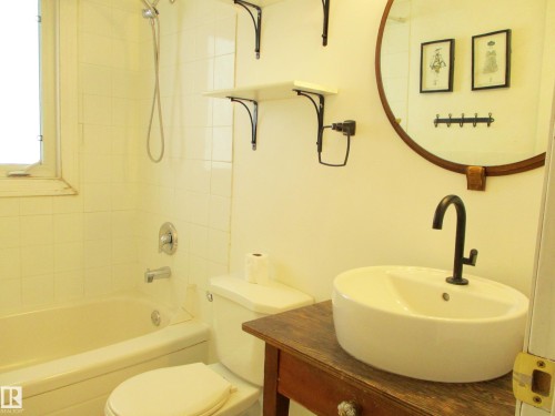 Full 4pc Bathroom featuring a white ceramic vessel sink with a matte black faucet, - 12115 64 Street Nw, Edmonton, AB - Indoor Photo Showing Bathroom