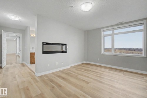 1225 5151 Windermere Boulevard, Edmonton, AB - Indoor With Fireplace