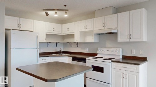 228 2305 35A Avenue, Edmonton, AB - Indoor Photo Showing Kitchen With Double Sink