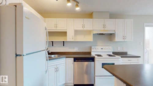 228 2305 35A Avenue, Edmonton, AB - Indoor Photo Showing Kitchen With Double Sink
