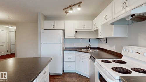228 2305 35A Avenue, Edmonton, AB - Indoor Photo Showing Kitchen With Double Sink