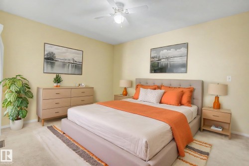 Carpeted room featuring light-colored walls and a ceiling fan with integrated lighting - 1542 54 Street, Edmonton, AB - Indoor Photo Showing Bedroom