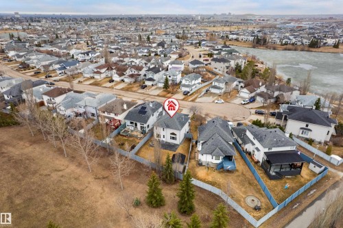 Aerial perspective highlighting multiple residential properties and a nearby body of water - 14755 131 Street Nw, Edmonton, AB - Outdoor With View