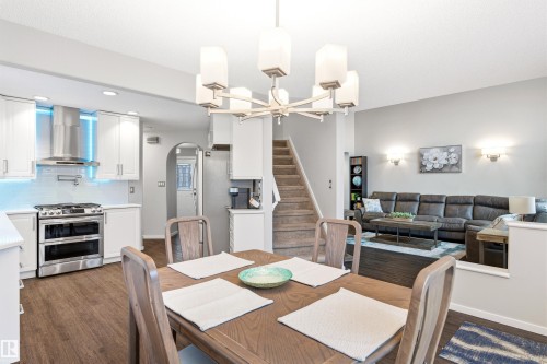 Open-concept dining area with wood-finish flooring - 14755 131 Street Nw, Edmonton, AB - Indoor Photo Showing Other Room