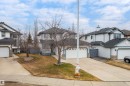 Two-story residence featuring light-colored siding and a dark shingle roof - 14755 131 Street Nw, Edmonton, AB  - Outdoor With Facade 