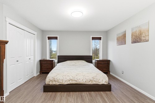 Bedroom featuring wood-finish flooring, light gray walls, and white trim - 14755 131 Street Nw, Edmonton, AB - Indoor Photo Showing Bedroom