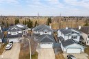 Two-story property featuring a front-facing attached two-car garage, light-colored exterior siding with contrasting trim, and a dark shingled roof - 14755 131 Street Nw, Edmonton, AB  - Outdoor 