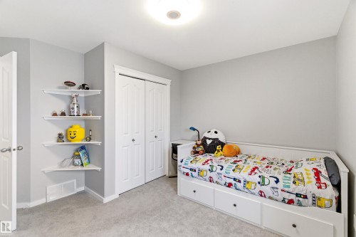 Room featuring light gray wall paint, white trim, and light gray carpeted flooring - 14755 131 Street Nw, Edmonton, AB - Indoor Photo Showing Bedroom