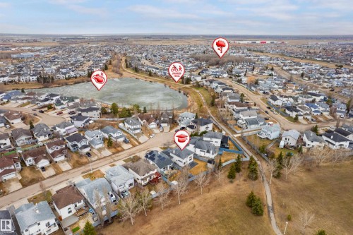 Aerial perspective showcasing a residential neighborhood with diverse architectural styles, visible streets, and mature trees - 14755 131 Street Nw, Edmonton, AB - Outdoor With View