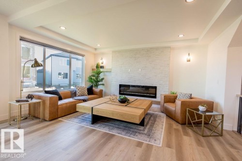 102 Bluff Cove, Leduc, AB - Indoor Photo Showing Living Room With Fireplace