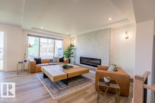102 Bluff Cove, Leduc, AB - Indoor Photo Showing Living Room With Fireplace