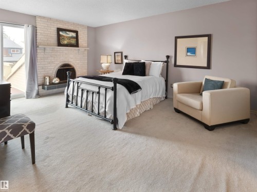 12335 25 Avenue, Edmonton, AB - Indoor Photo Showing Bedroom With Fireplace