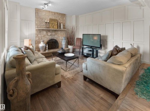 12335 25 Avenue, Edmonton, AB - Indoor Photo Showing Living Room With Fireplace