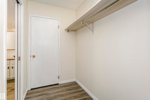 Closet space featuring a single shelf and hanging rod - 303 10026 112 Street, Edmonton, AB - Indoor