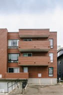 Multi-level apartment building featuring horizontal wood-finish siding - 