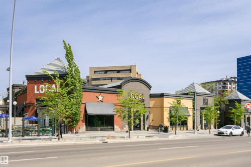 Street-level commercial buildings featuring varied facades and prominent storefronts - 303 10026 112 Street, Edmonton, AB - Outdoor