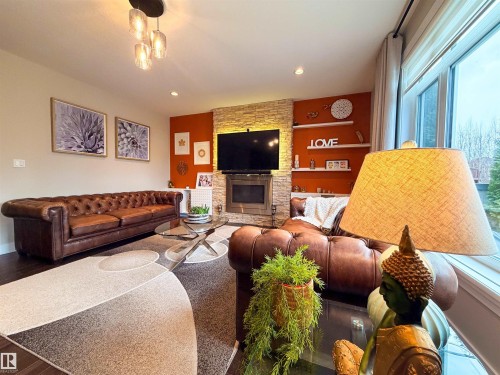 9004 24 Avenue, Edmonton, AB - Indoor Photo Showing Living Room With Fireplace